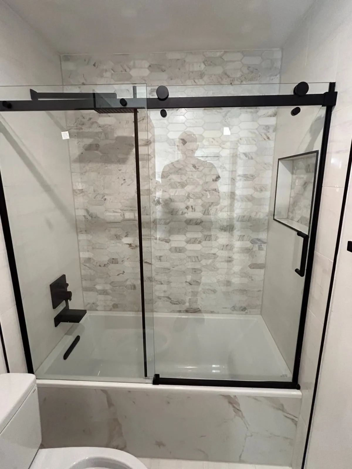 Finished: Tub-shower with sliding glass and picket tile