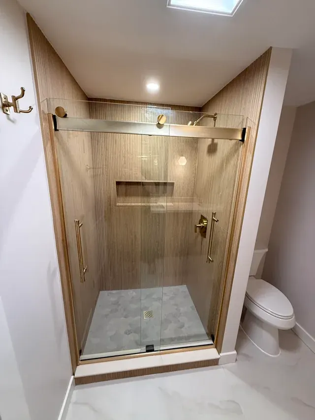 After: Primary bathroom with fluted-tile shower