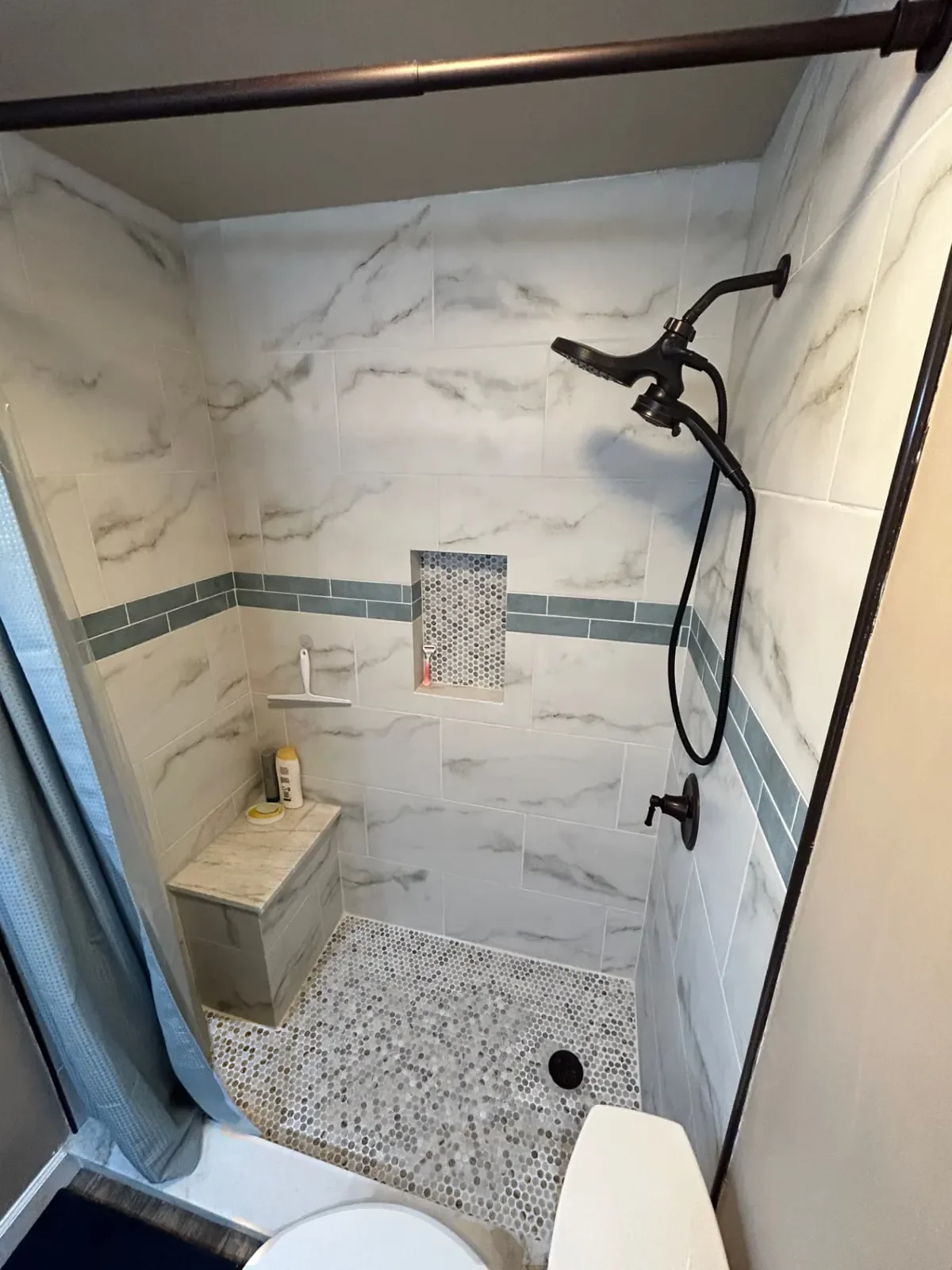 After: Hall bathroom with tiled shower and bench