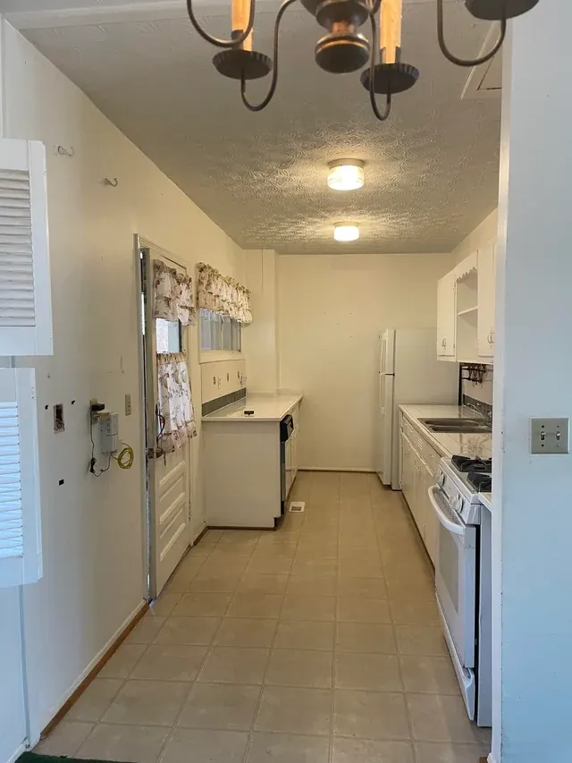 Before: Green galley kitchen